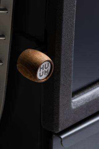 HUUM HIVE Heat Series wood-fired sauna stove with firebox extension and cast iron door
