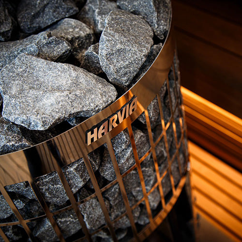 Harvia Cilindro stove with fire inside, wooden sauna
