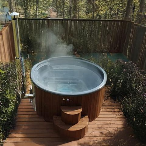 SaunaLife Model S4N outdoor wood-burning hot tub with thermo-spruce exterior