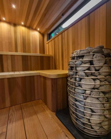 HUUM HIVE Mini 6kW compact electric sauna heater with UKU control panel and sauna stones