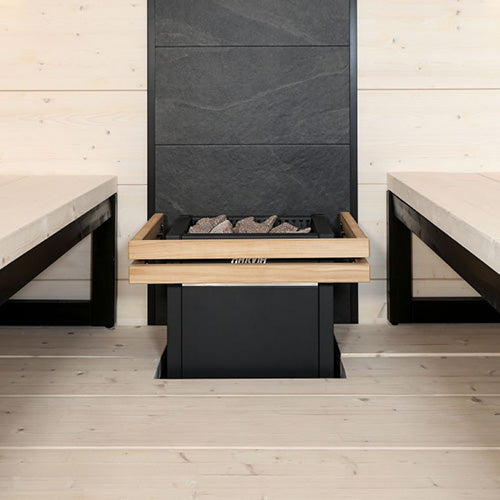 sauna heater with wooden trim and stones