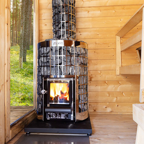 Harvia Cilindro sauna stove with wood and fire visible