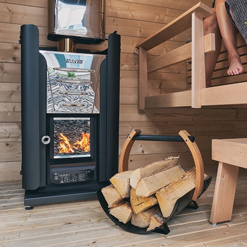 Harvia firewood carrier with stacked logs and greenery