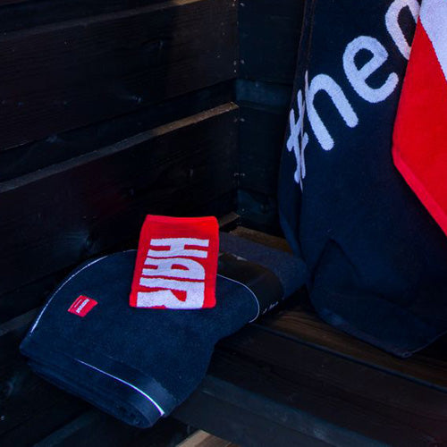 Harvia hand towel on sauna bench with cushion
