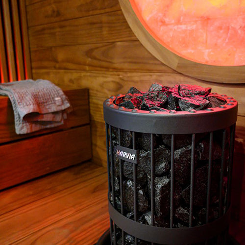Harvia sauna heater with stones in a sauna room