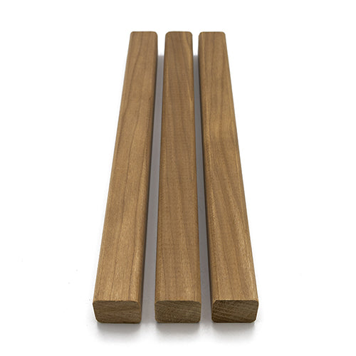 Three Thermo-Aspen 28mm x 28mm wood pieces with eased edges