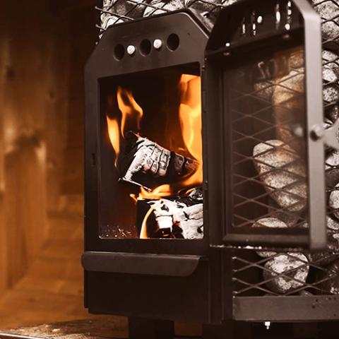 Cozy Heat O wood-burning sauna stove with circular rim design